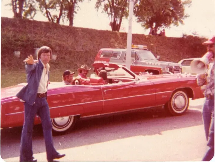 Smokey and the Bandit movie behind the scenes pic with Burt Reynolds, Sally Field and Jerry Reed in red Cadillac.