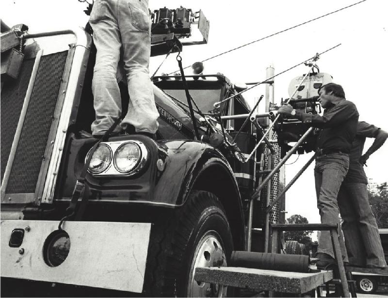 Smokey and the Bandit movie behind the scenes - Hal Needham on Snowman's rig with camera.