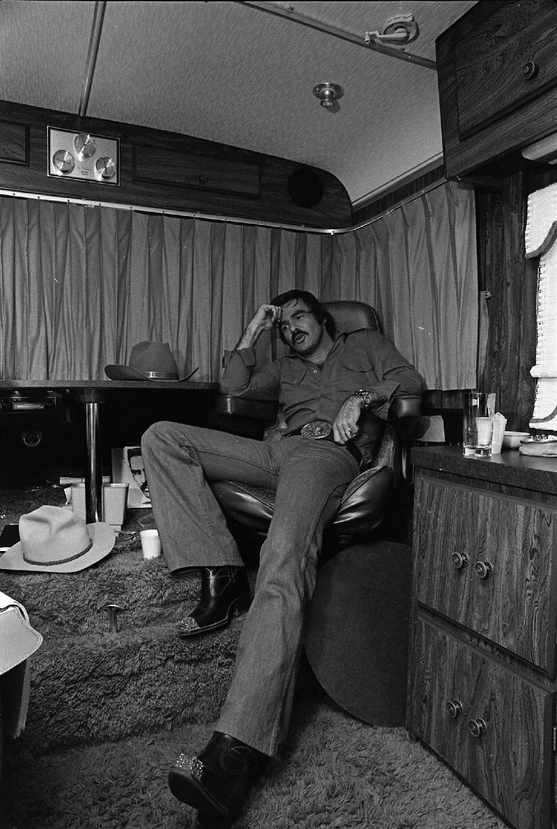 Smokey and the Bandit movie behind the scenes - Burt Reynolds taking a break in his trailer.