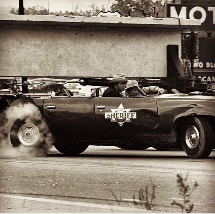 Smokey and the Bandit movie behind the scenes - Buford T. Justice car having roof torn off.