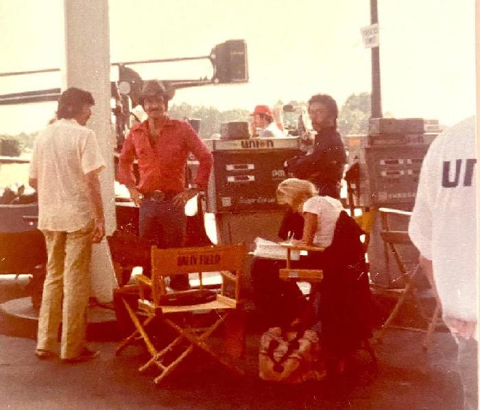 Smokey and the Bandit movie behind the scenes pic with Burt Reynolds at the gas station.