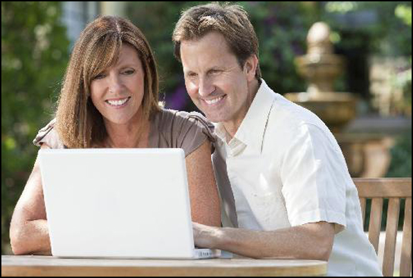 Parents looking at laptop PC